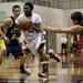 Milan sophomore Latin Davis drives toward the rim against Chelsea defenders on Friday. Milan won 71-40. Daniel Brenner I AnnArbor.com